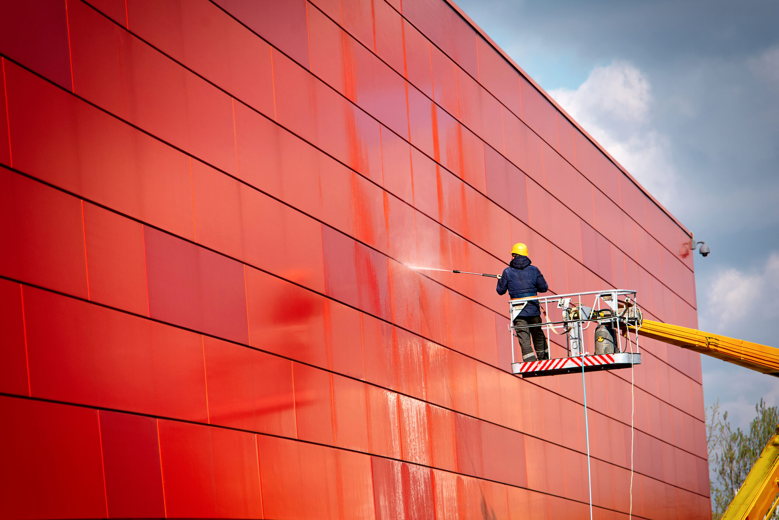 Worker,Of,Professional,Facade,Cleaning,Services,Washing,The,Red,Wall.